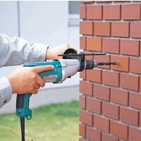 Ударная дрель Makita HP 2051